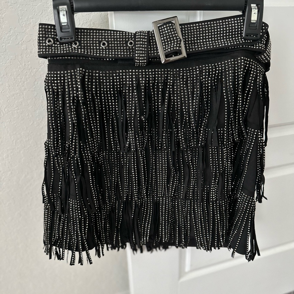 Black, size Small. No tag but never worn. So beautiful in person!